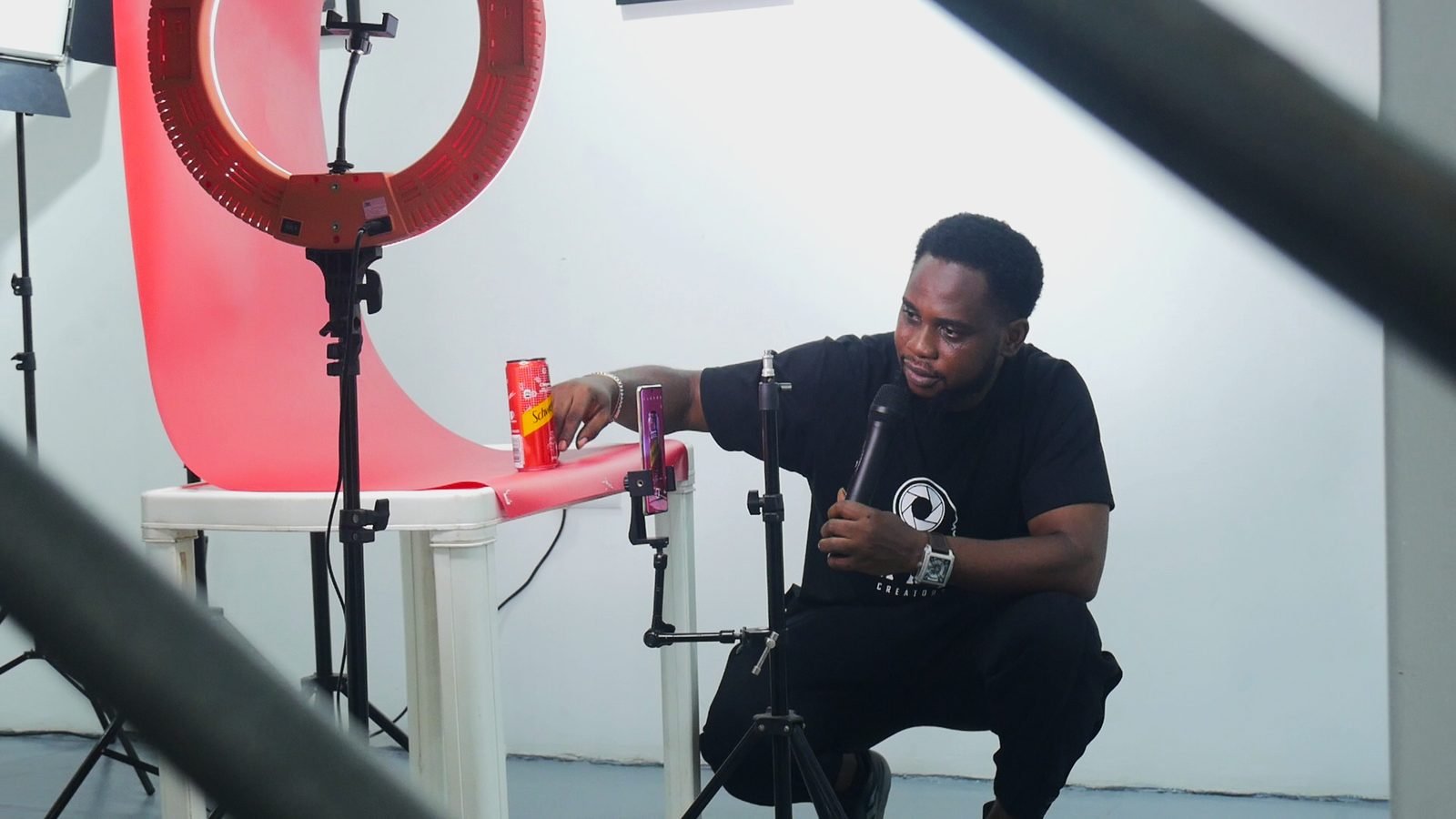Tutor demonstrating product lighting technique